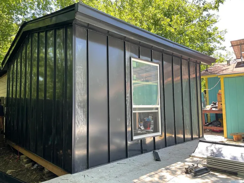 Black standing seam metal wall panels for Roof Inspection in Russellville